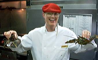 Oscar holding up 2 chicken lobstahs